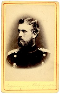 Leopold von Hohenzollern wearing a uniform, looking to the side. Cursive writing is barely legible at the bottom of the card. 