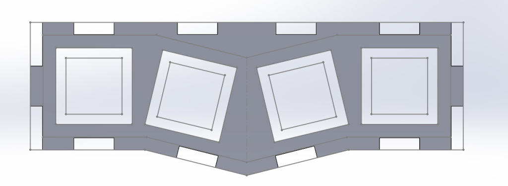 Digital sketch of fidget toy design in SoildWorks. Finger joint rectangles surround the outside lines, and outside square holes are cut out.