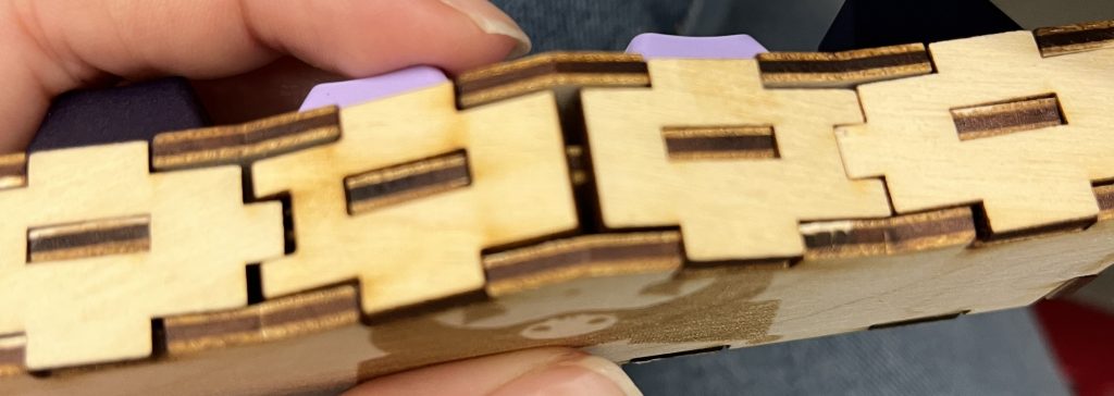 Front view of fidget toy, showing a small gap between laser cut panels. 