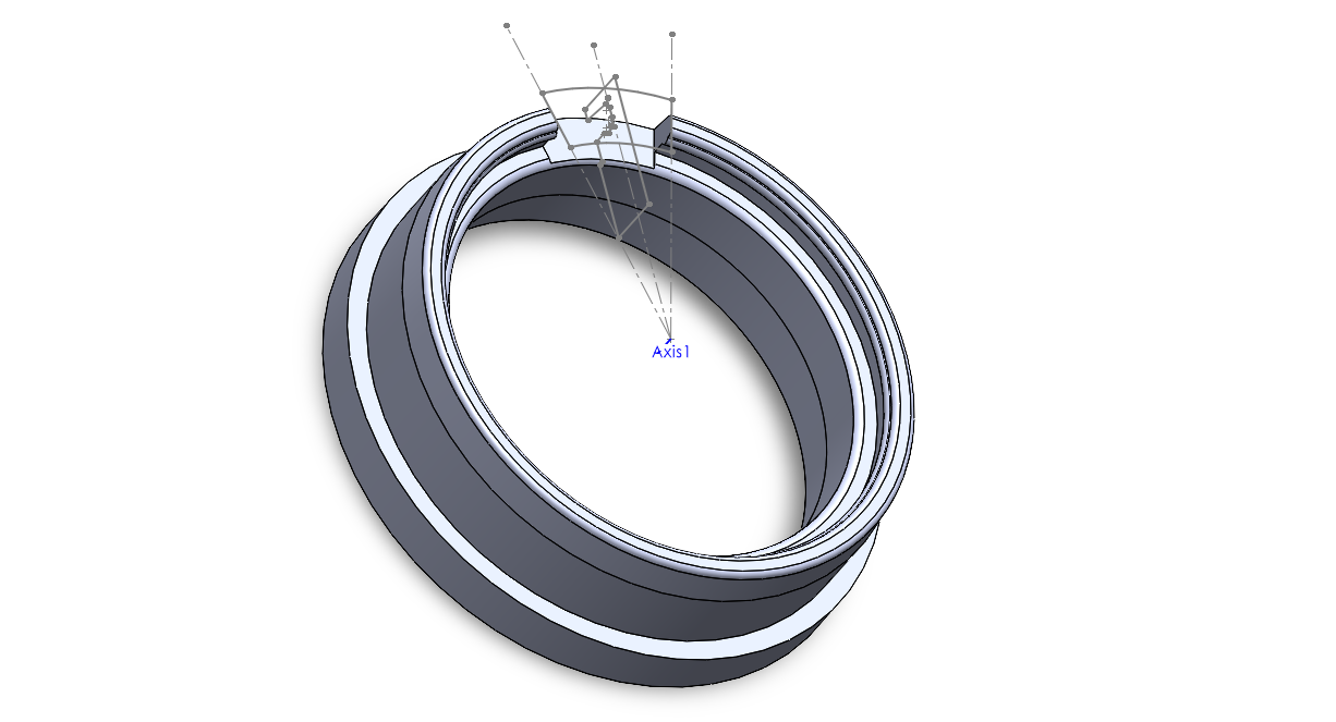 Ring-like design with an upper lip that protrudes out. The lip at the top is disrupted by a 30 degree wedge cut out, which leaves a gap in the lip. 