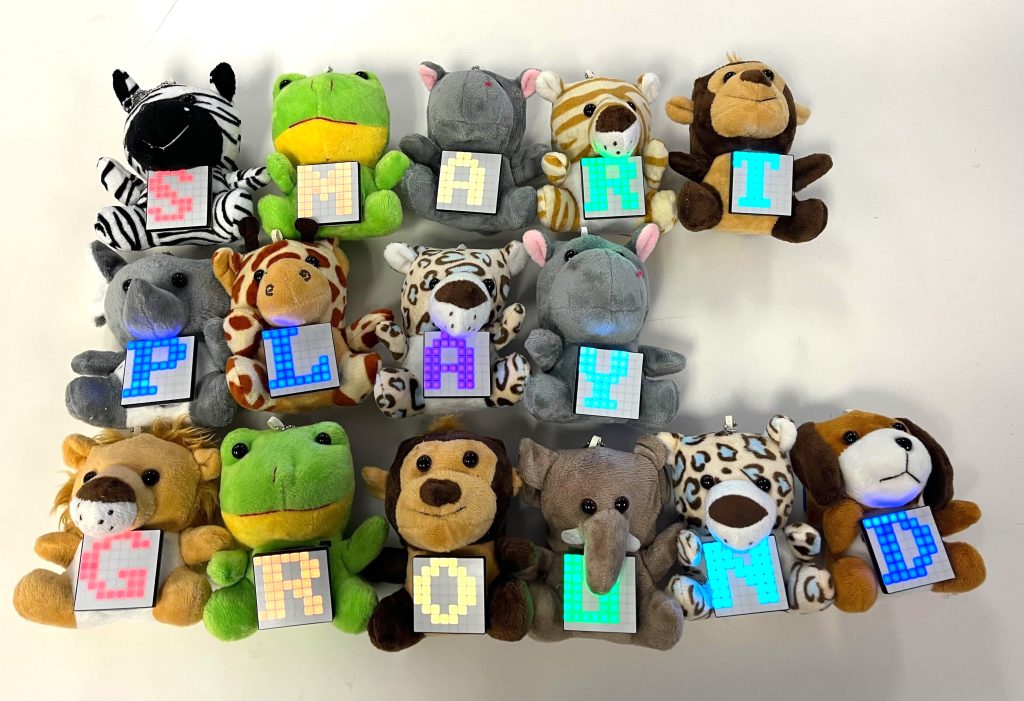 Stuffed animals that spell out SMART PLAY GROUND