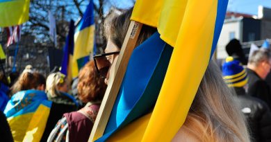 people holding Ukrainian flags