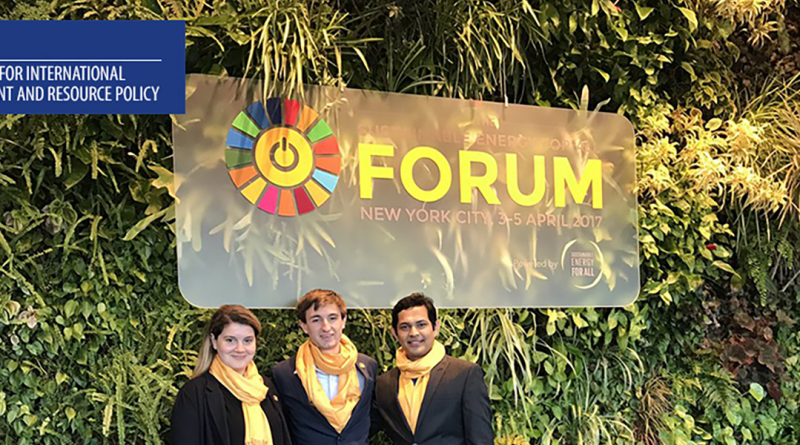 Photo of CIERP fellows standing in front of a sign for the Sustainable Energy 4 All Forum in NYC, April 2017