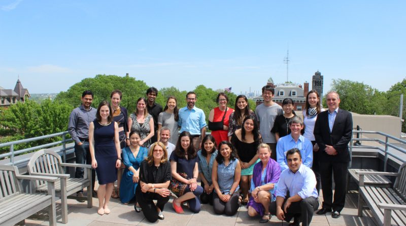 Group photo of CIERP faculty on a Fletcher School rooftop terrace