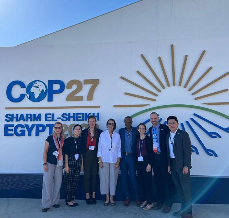 Team in front of COP27 sign