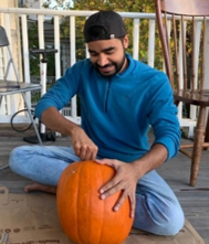 Mohit carves a pumpkin