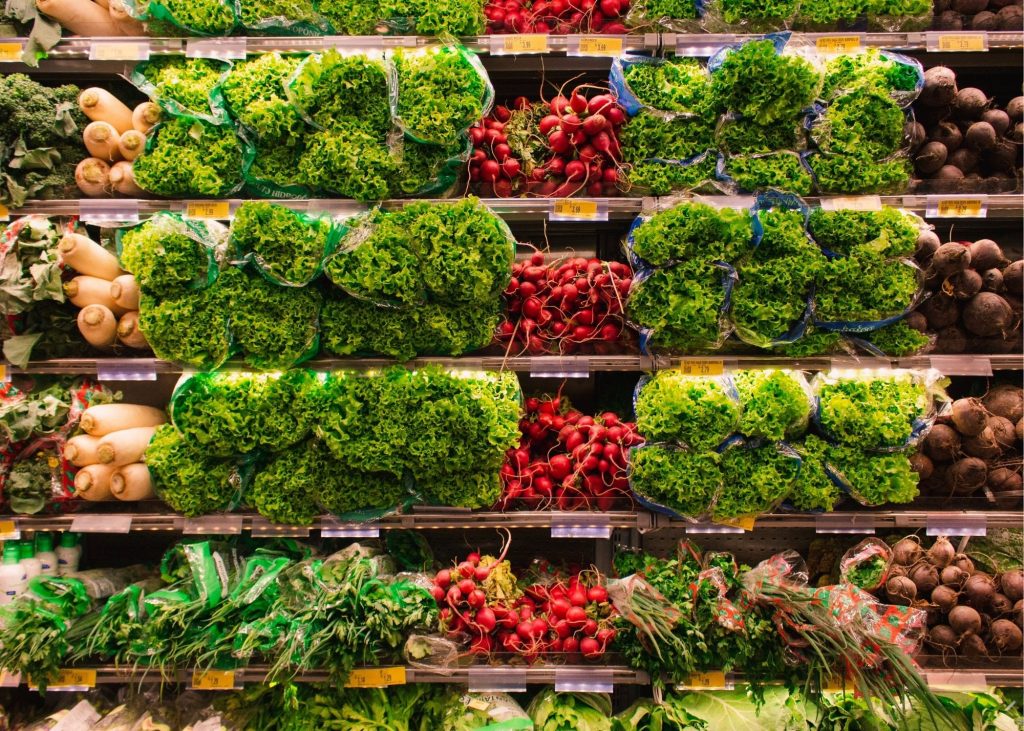 an image of stacked vegetables in a grocery store