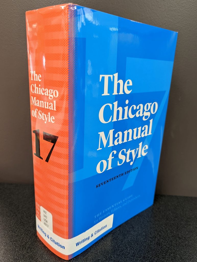 A photo of the Chicago Manual of Style 17th edition featuring the white tape and blue lettering of the Writing & Citation section