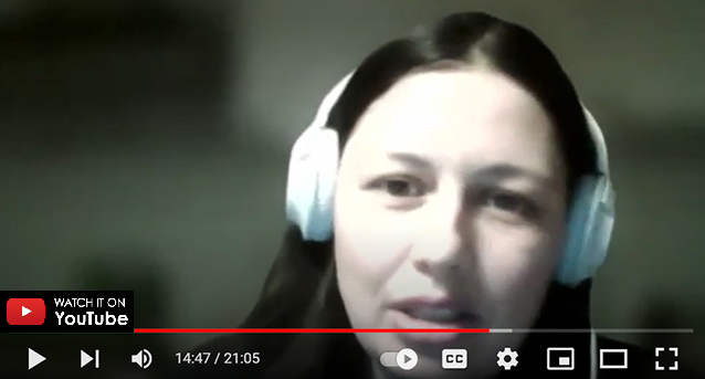 Close up of Kateryna (Kate) Ryzha, a Project Manager, and the head of PMO at Softjourn. wearing white headphones