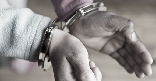 person- in - handcuffs