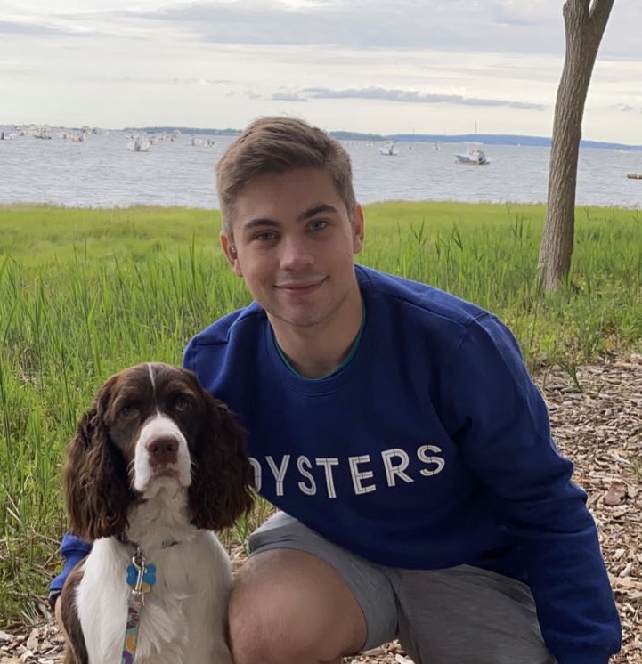 Ryan in his Hometown with One of His Many Dogs