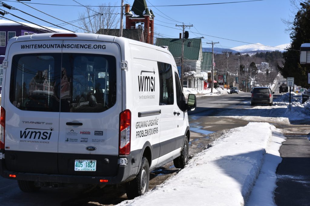WMSI van driving on snowy street