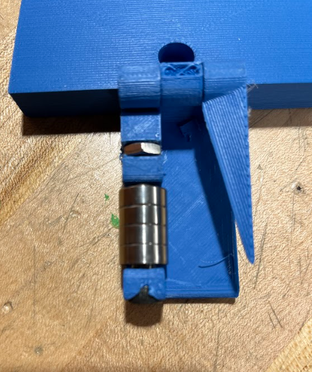 The half of our device containing the wedge. The wheel bearings are shown attached via a shoulder bolt and hex nut.