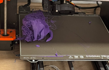 Second failed attempt of 3D printing. Shows only bottom half of cat figure as top half did not print properly.