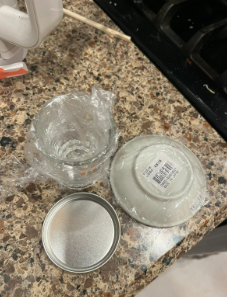 Plate, Cup, and Tin covered in Saran Wrap