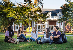 Undergraduate students pose for photos in front of Bendetson Hall on the Medford/Somerville Campus on October 12, 2015. (Alonso Nichols/Tufts University)