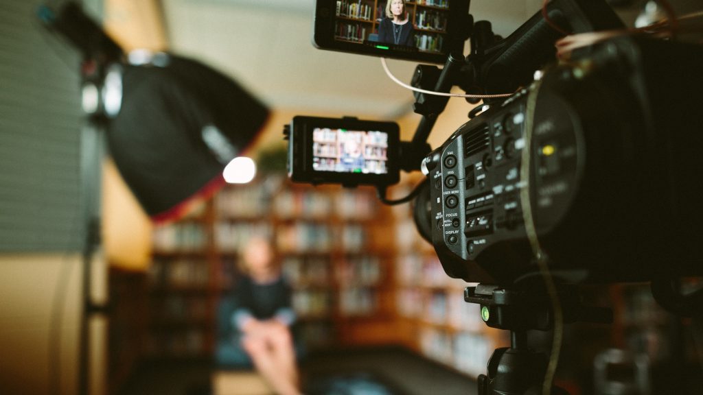 video camera filming an interview