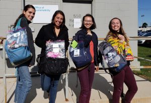 interns with zero waste week bags