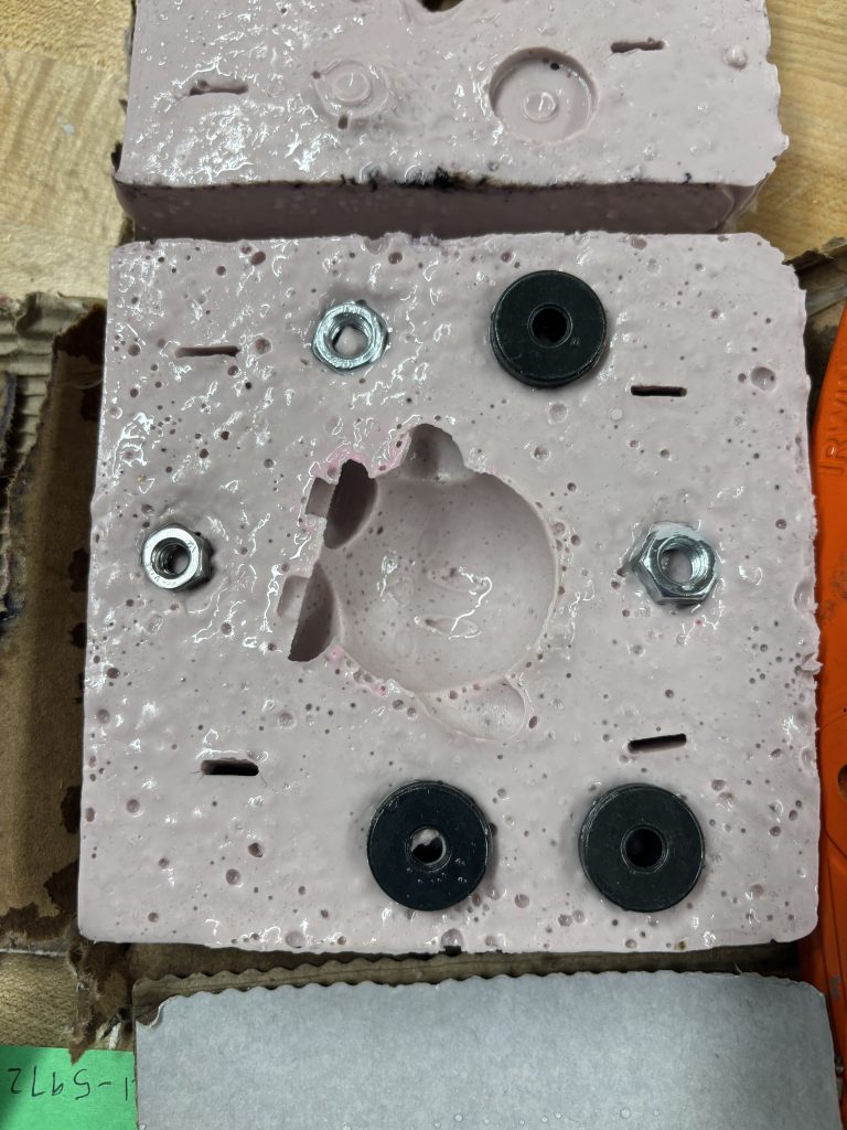 A picture of the bottom the Kirby mold with guide pieces.